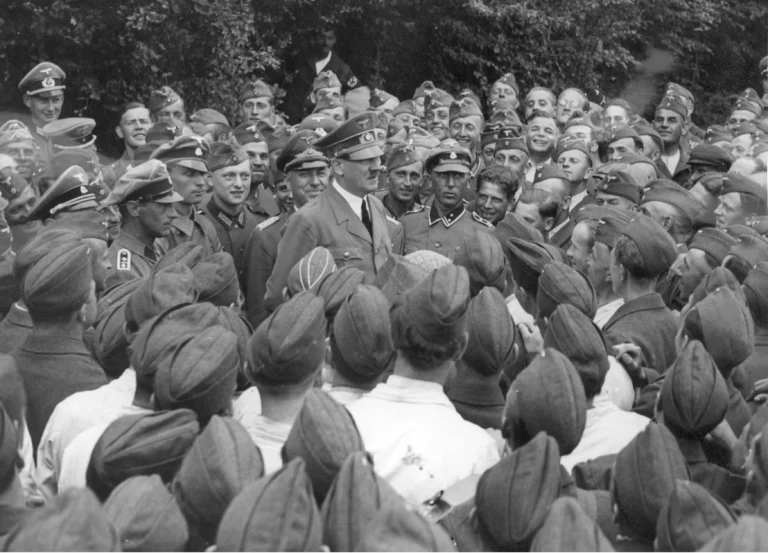 Adolf Hitler among Luftwaffe soldiers at a field airport on the Eastern Front. Behind him, on the left, Marshal Albert Kesselring. January 1943