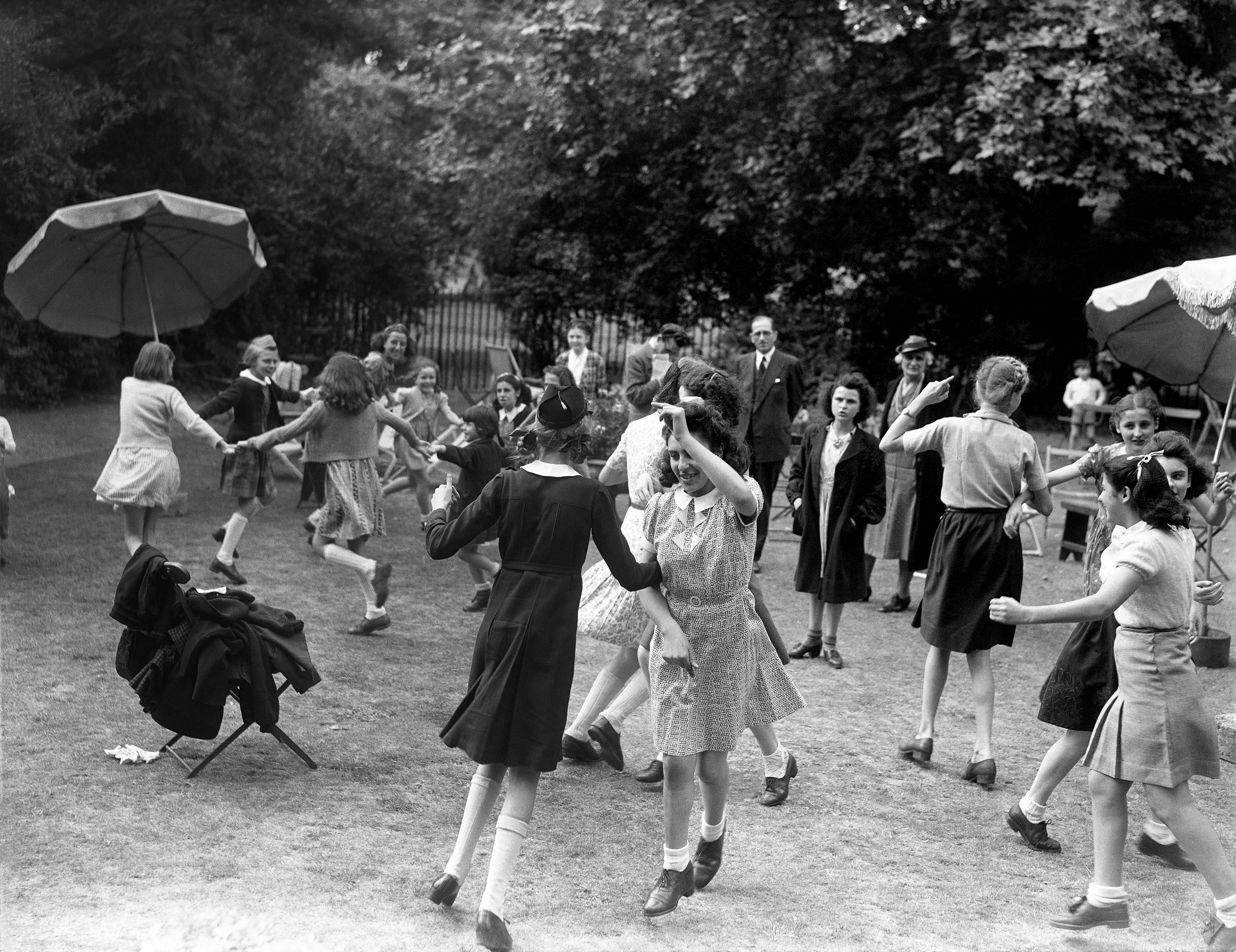 29th July 1945 TOPFOTO CODE: PD3001206 A party of French children have arrived in England for rest and recuperation. Suffering from the various ill effects of the war years, the children are being looked after in the London County Council Rest Centre before being sent to various Hostels and homes in the country. Photo shows: Some of the French children enjoying the delights of the children’s playground in Battersea Rest Centre. © Topfoto / Peter Deleuran | Used with exclusive permission.